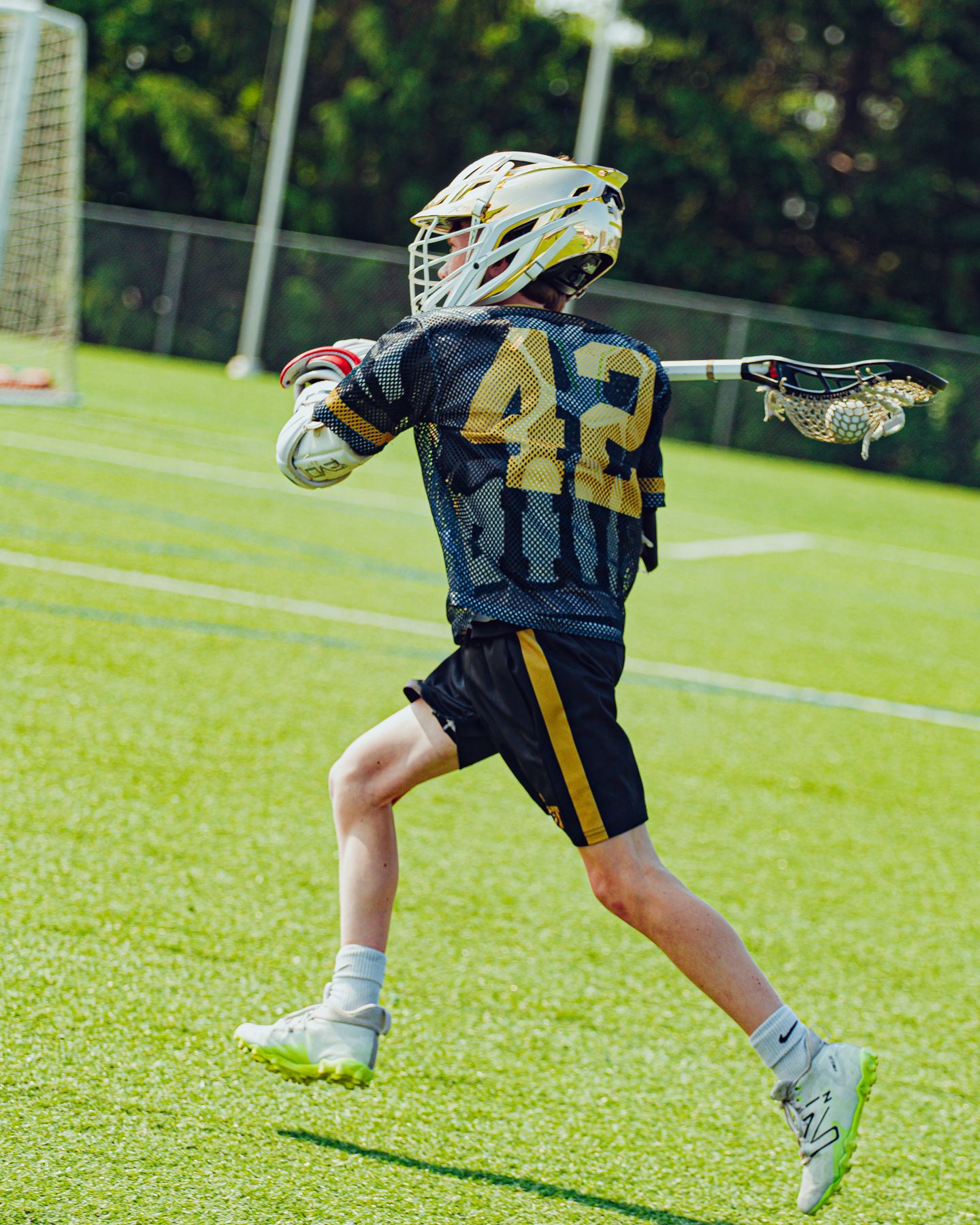 BEAST player number 42 cradling on the run