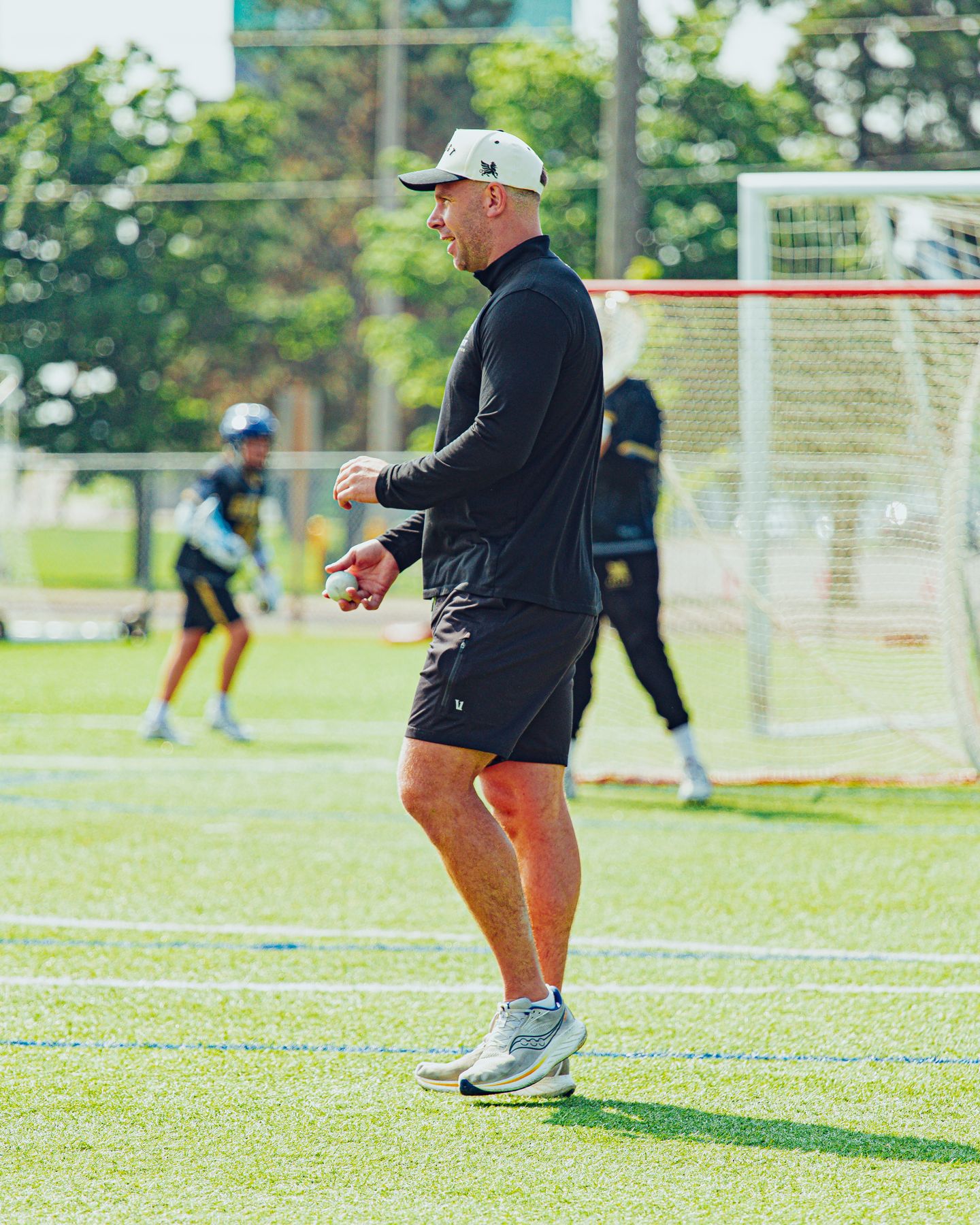 Coach Reid Acton running a practice